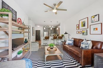 A living room with a black and white checkered floor.